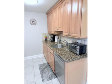 A most desirable waterfront location near pooles beautifully on Hillsboro Pines Golf in Florida - for sale on GolfHomes.com, golf home, golf lot