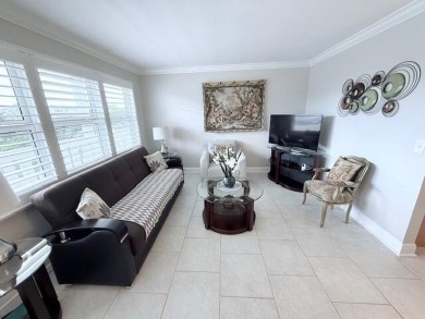 A most desirable waterfront location near pooles beautifully on Hillsboro Pines Golf in Florida - for sale on GolfHomes.com, golf home, golf lot