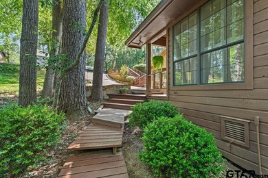 Enjoy breathtaking lake views from nearly every room in this on Hide-A-Way Lake Golf Course in Texas - for sale on GolfHomes.com, golf home, golf lot