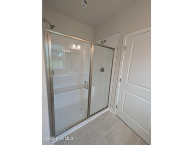 QUICK MOVE IN!! Welcome to Resort Style Living a golf cart ride on Sea Trail Golf Resort in North Carolina - for sale on GolfHomes.com, golf home, golf lot