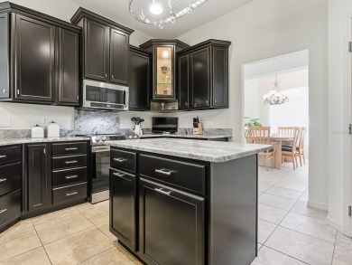Discover your Florida oasis in this impeccably updated home on Lakes of Lady Lake Golf Course in Florida - for sale on GolfHomes.com, golf home, golf lot