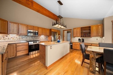 This home reflects a deep appreciation for quality and comfort on Cedar River Golf Course in Michigan - for sale on GolfHomes.com, golf home, golf lot