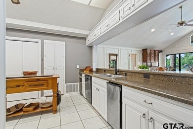 Enjoy breathtaking lake views from nearly every room in this on Hide-A-Way Lake Golf Course in Texas - for sale on GolfHomes.com, golf home, golf lot