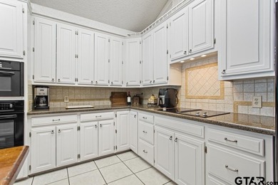 Enjoy breathtaking lake views from nearly every room in this on Hide-A-Way Lake Golf Course in Texas - for sale on GolfHomes.com, golf home, golf lot