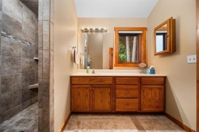This home reflects a deep appreciation for quality and comfort on Cedar River Golf Course in Michigan - for sale on GolfHomes.com, golf home, golf lot