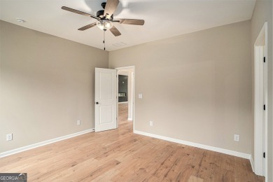This modern farmhouse ranch-style home is situated right on the on Cabin Creek Golf Club in Georgia - for sale on GolfHomes.com, golf home, golf lot