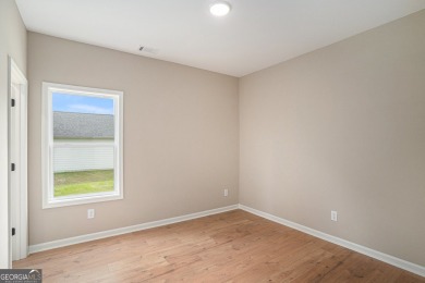 This modern farmhouse ranch-style home is situated right on the on Cabin Creek Golf Club in Georgia - for sale on GolfHomes.com, golf home, golf lot