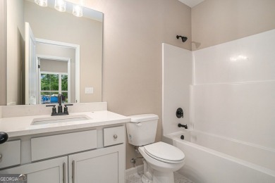 This modern farmhouse ranch-style home is situated right on the on Cabin Creek Golf Club in Georgia - for sale on GolfHomes.com, golf home, golf lot