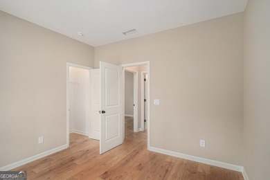 This modern farmhouse ranch-style home is situated right on the on Cabin Creek Golf Club in Georgia - for sale on GolfHomes.com, golf home, golf lot