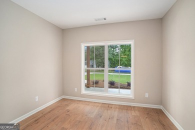 This modern farmhouse ranch-style home is situated right on the on Cabin Creek Golf Club in Georgia - for sale on GolfHomes.com, golf home, golf lot
