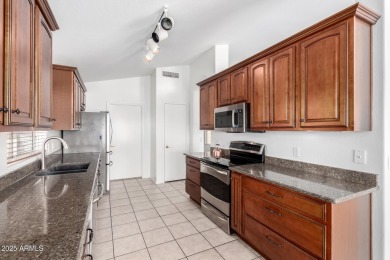 Tucked away in a charming cul-de-sac, this delightful 2-bedroom on Coyote Lakes Golf Club in Arizona - for sale on GolfHomes.com, golf home, golf lot