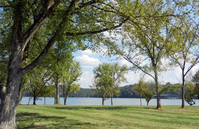 Beautiful mostly level, water view homesite near the Marina in on Wind River Golf Course in Tennessee - for sale on GolfHomes.com, golf home, golf lot