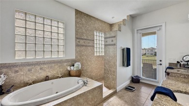 Come tour this exceptionally renovated 2 story courtyard home on Reunion Resort Golf Course in Florida - for sale on GolfHomes.com, golf home, golf lot