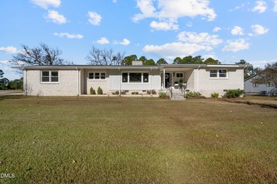 Elevated one-level living in this updated brick home on the golf on Wilson Country Club in North Carolina - for sale on GolfHomes.com, golf home, golf lot
