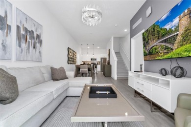 This beautifully designed 4-bedroom, 4-bathroom townhouse plus a on Reunion Resort Golf Course in Florida - for sale on GolfHomes.com, golf home, golf lot