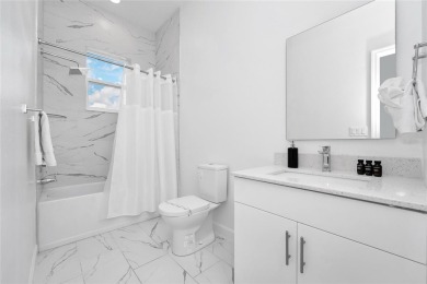 This beautifully designed 4-bedroom, 4-bathroom townhouse plus a on Reunion Resort Golf Course in Florida - for sale on GolfHomes.com, golf home, golf lot