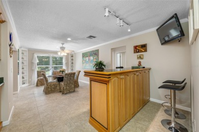 This updated home offers one of the most stunning views in all on Highland Lakes Executive Golf Course in Florida - for sale on GolfHomes.com, golf home, golf lot
