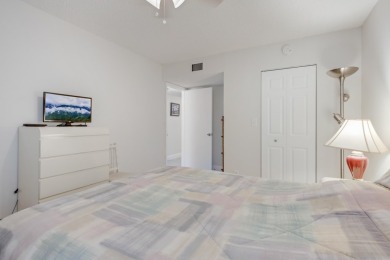 WELCOME TO THIS SPACIOUS, ATTRACTIVE CORNER, TOP FLOOR  CONDO on Poinciana Golf Club in Florida - for sale on GolfHomes.com, golf home, golf lot