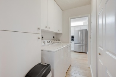 WELCOME TO THIS SPACIOUS, ATTRACTIVE CORNER, TOP FLOOR  CONDO on Poinciana Golf Club in Florida - for sale on GolfHomes.com, golf home, golf lot
