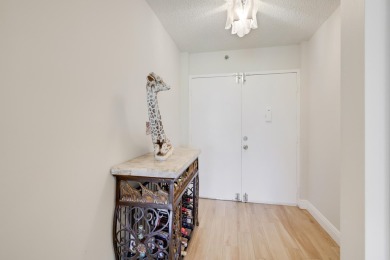 WELCOME TO THIS SPACIOUS, ATTRACTIVE CORNER, TOP FLOOR  CONDO on Poinciana Golf Club in Florida - for sale on GolfHomes.com, golf home, golf lot