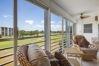 WELCOME TO THIS SPACIOUS, ATTRACTIVE CORNER, TOP FLOOR  CONDO on Poinciana Golf Club in Florida - for sale on GolfHomes.com, golf home, golf lot