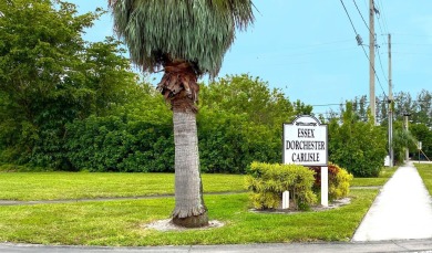WELCOME TO THIS SPACIOUS, ATTRACTIVE CORNER, TOP FLOOR  CONDO on Poinciana Golf Club in Florida - for sale on GolfHomes.com, golf home, golf lot