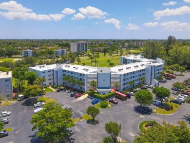 WELCOME TO THIS SPACIOUS, ATTRACTIVE CORNER, TOP FLOOR  CONDO on Poinciana Golf Club in Florida - for sale on GolfHomes.com, golf home, golf lot