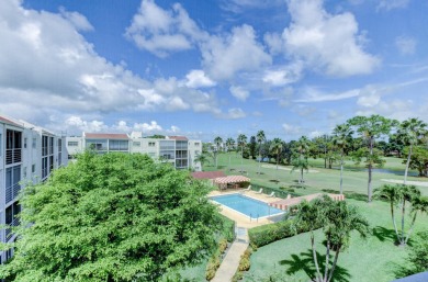 WELCOME TO THIS SPACIOUS, ATTRACTIVE CORNER, TOP FLOOR  CONDO on Poinciana Golf Club in Florida - for sale on GolfHomes.com, golf home, golf lot