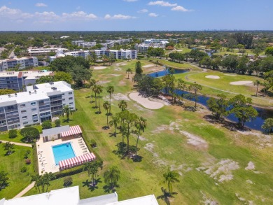 WELCOME TO THIS SPACIOUS, ATTRACTIVE CORNER, TOP FLOOR  CONDO on Poinciana Golf Club in Florida - for sale on GolfHomes.com, golf home, golf lot