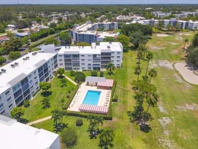 WELCOME TO THIS SPACIOUS, ATTRACTIVE CORNER, TOP FLOOR  CONDO on Poinciana Golf Club in Florida - for sale on GolfHomes.com, golf home, golf lot
