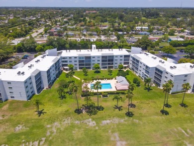 WELCOME TO THIS SPACIOUS, ATTRACTIVE CORNER, TOP FLOOR  CONDO on Poinciana Golf Club in Florida - for sale on GolfHomes.com, golf home, golf lot