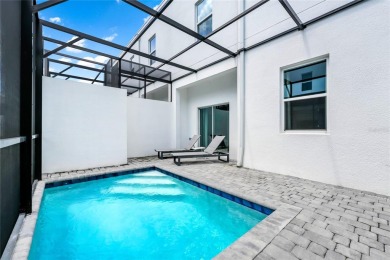 This beautifully designed 4-bedroom, 4-bathroom townhouse plus a on Reunion Resort Golf Course in Florida - for sale on GolfHomes.com, golf home, golf lot
