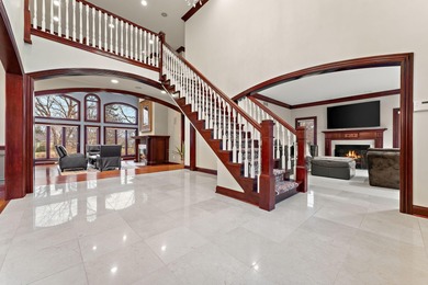 From the moment you arrive, this custom home in the gated Sand on Sand Creek Golf and Country Club  in Indiana - for sale on GolfHomes.com, golf home, golf lot