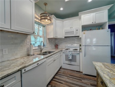 Come and enjoy this fun, colorful beach house in Mustang Royale on Palmilla Beach Golf Club in Texas - for sale on GolfHomes.com, golf home, golf lot