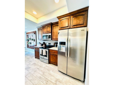 Income-Producing Waterfront Luxury! This channel-front townhome on South Padre Island Golf Club in Texas - for sale on GolfHomes.com, golf home, golf lot