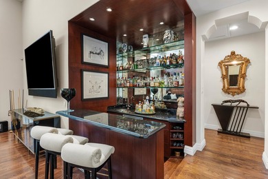 This exceptional lakeside estate blends sophistication, comfort on Bocaire Country Club in Florida - for sale on GolfHomes.com, golf home, golf lot