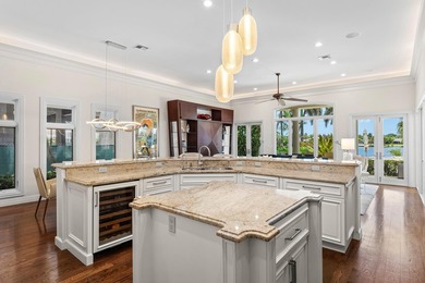 This exceptional lakeside estate blends sophistication, comfort on Bocaire Country Club in Florida - for sale on GolfHomes.com, golf home, golf lot