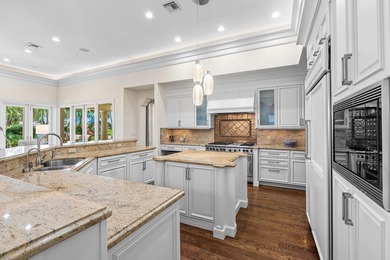 This exceptional lakeside estate blends sophistication, comfort on Bocaire Country Club in Florida - for sale on GolfHomes.com, golf home, golf lot