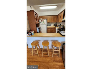 For your downsizing pleasure---a perfect corner unit away from on Leisure World Golf Club in Maryland - for sale on GolfHomes.com, golf home, golf lot