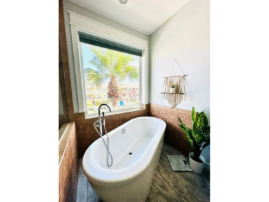 Income-Producing Waterfront Luxury! This channel-front townhome on South Padre Island Golf Club in Texas - for sale on GolfHomes.com, golf home, golf lot