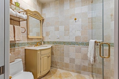 This exceptional lakeside estate blends sophistication, comfort on Bocaire Country Club in Florida - for sale on GolfHomes.com, golf home, golf lot