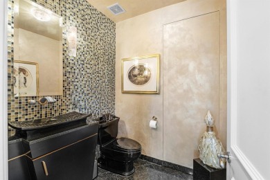 This exceptional lakeside estate blends sophistication, comfort on Bocaire Country Club in Florida - for sale on GolfHomes.com, golf home, golf lot