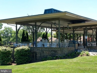 For your downsizing pleasure---a perfect corner unit away from on Leisure World Golf Club in Maryland - for sale on GolfHomes.com, golf home, golf lot