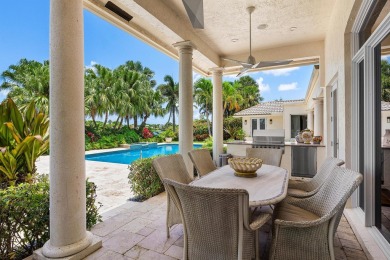 This exceptional lakeside estate blends sophistication, comfort on Bocaire Country Club in Florida - for sale on GolfHomes.com, golf home, golf lot