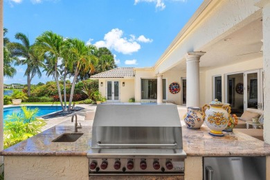 This exceptional lakeside estate blends sophistication, comfort on Bocaire Country Club in Florida - for sale on GolfHomes.com, golf home, golf lot