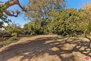 Set privately above the street in a premier Cheviot Hills on Rancho Park Golf Course in California - for sale on GolfHomes.com, golf home, golf lot