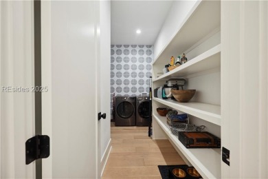 Experience the height of modern luxury with this 2023 on The Golf Club at Indigo Run in South Carolina - for sale on GolfHomes.com, golf home, golf lot