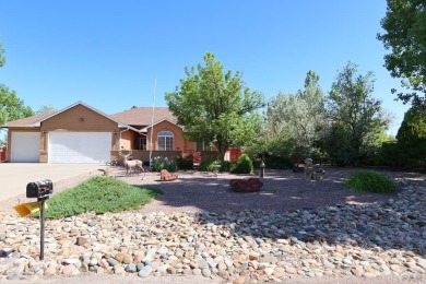 FABULOUS RANCHER WITH PARTIALLY FINISHED BASEMENT SHOWCASING AN on Desert Hawk At Pueblo West in Colorado - for sale on GolfHomes.com, golf home, golf lot