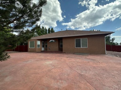 FABULOUS RANCHER WITH PARTIALLY FINISHED BASEMENT SHOWCASING AN on Desert Hawk At Pueblo West in Colorado - for sale on GolfHomes.com, golf home, golf lot