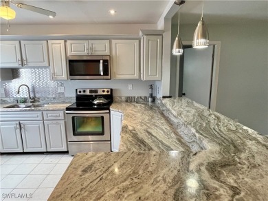 **BEAUTIFUL WIDE OPEN REMODELED KITCHEN WITH EXPANSIVE BREAKFAST on Myerlee Country Club in Florida - for sale on GolfHomes.com, golf home, golf lot